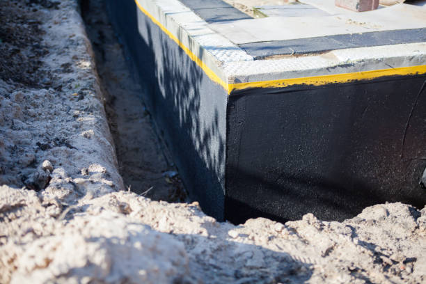 Professional Emergency Waterproofing technician working in Mount Pleasant, MI